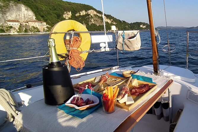 Private Tour on a Sailing Boat on Lake Maggiore with Aperitif and Music - Sunset sailing, aperitif music, and Santa Caterina del Sasso views